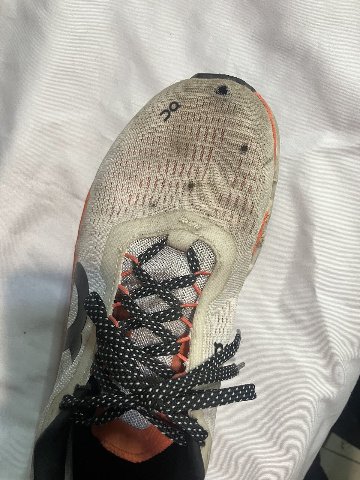 Finished shoe repair work showing precise stitching and sole replacement
